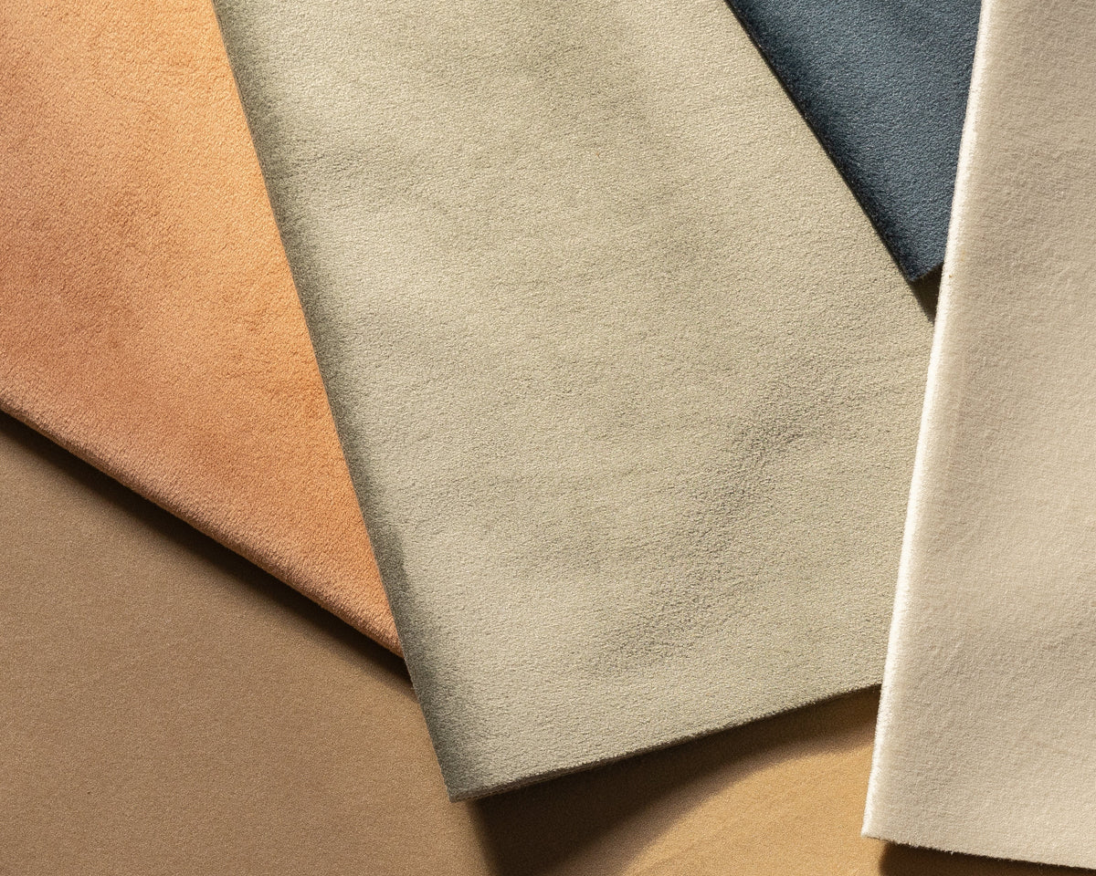 A folded stack of NEXT performance fabric swatches